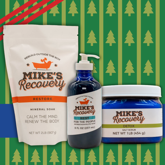 Mike's Recovery product set including a pouch, bottle, and jar on a green background with tree patterns.