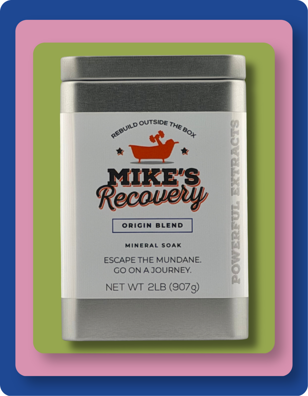 A rectangular metal tin of Mike's Recovery Mineral Soak shown on a layered pink, green, and blue background. The tin has a white label with black and orange text, featuring a guy in a tub with a dumbbell in his hand logo and the product name 'MIKE'S Recovery'.