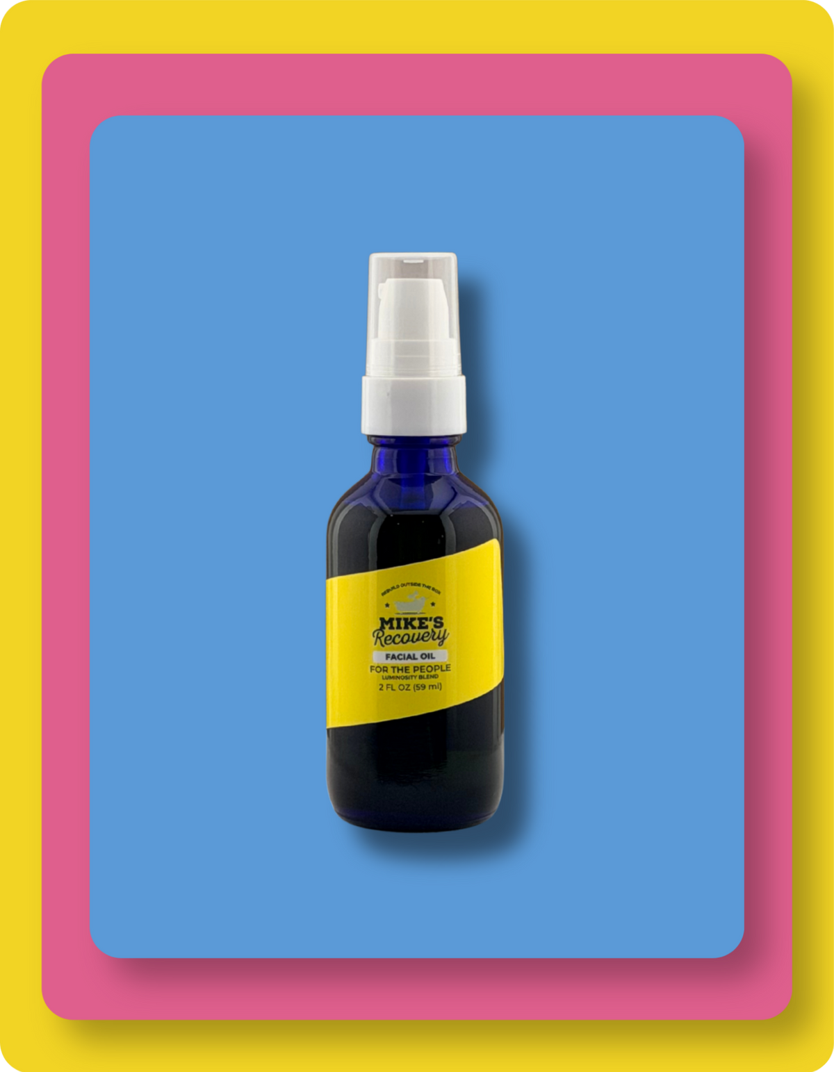 A dark blue glass spray bottle with a white pump dispenser and a bright yellow label reading Mike's Luminosity Facial Oil. The bottle is centered on a solid blue background, framed by a pink border and a yellow outer border.