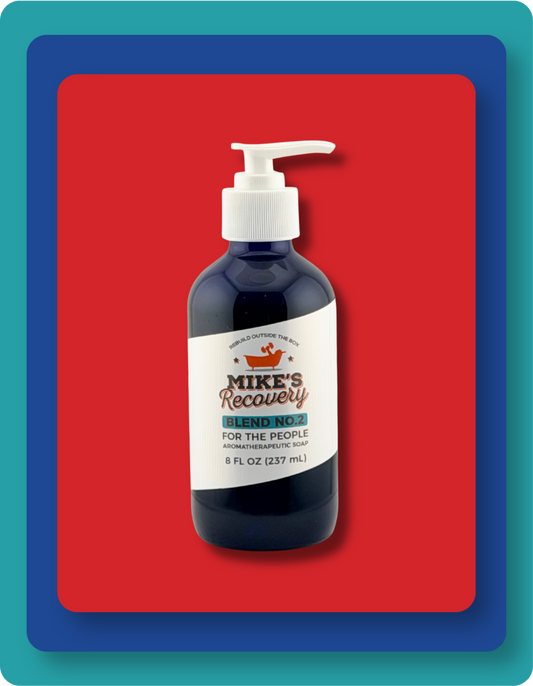 A dark blue pump bottle labeled 'Mike's Recovery Blend No 2  centered on a red square background with blue and teal border shapes.