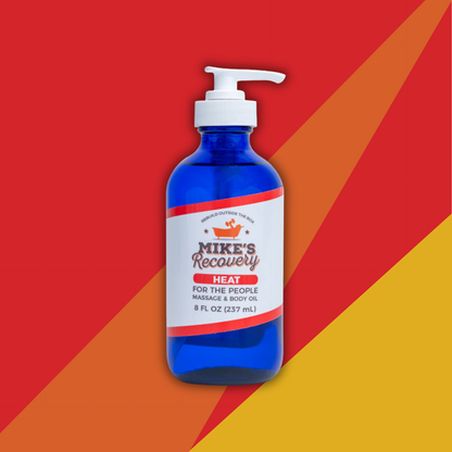Blue bottle of Heat massage oil by Mike's Recovery