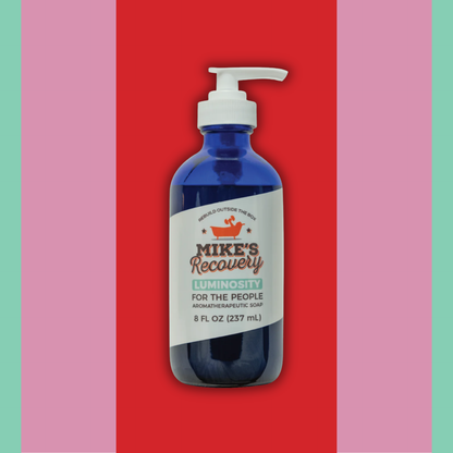 8oz bottle of Luminosity aromatherapy soap