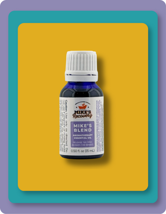 A small bottle of Mike's Recovery Aromatherapy Essential Oil Oil, 'Mike's Blend', in a dark blue glass bottle with a white cap and white label, set against a yellow and teal graphic background.