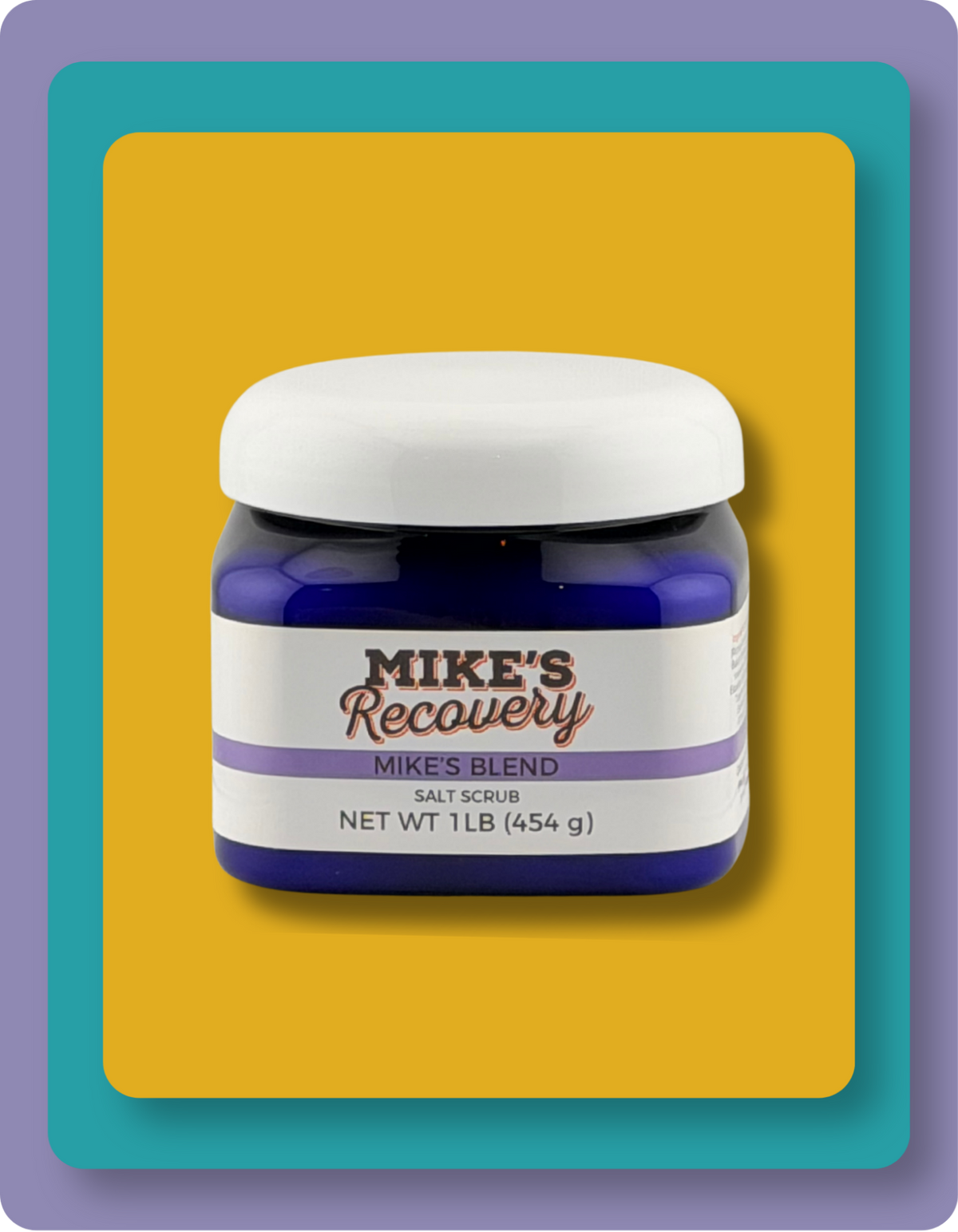 A jar of Mike's Recovery Salt Scrub, 'Mike's Blend', in a dark blue jar with a white lid and label, set against a yellow background with a teal and purple border.
