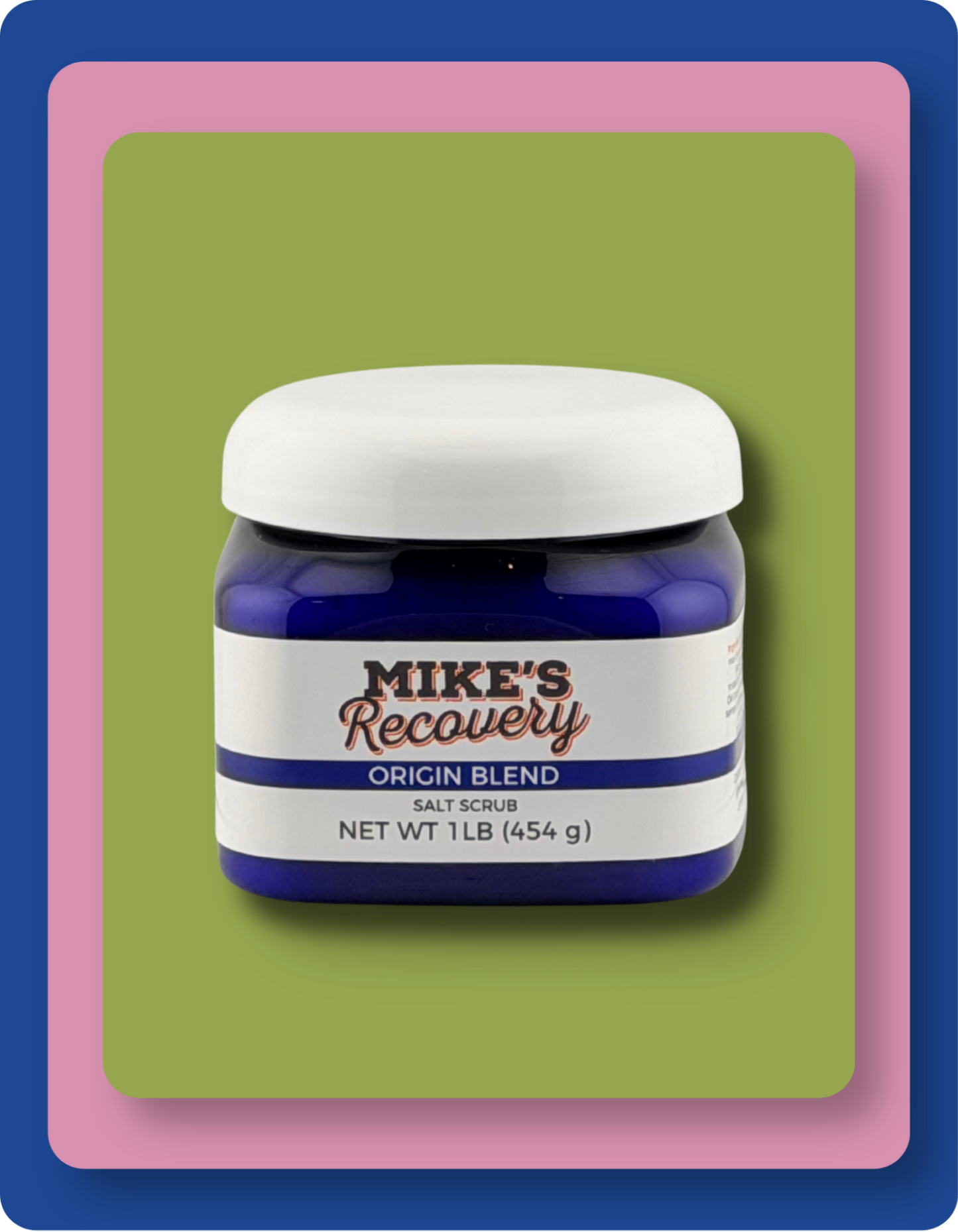 A jar of Mike's Recovery Origin Blend Salt Scrub, featuring a dark blue container, a white lid, and a white label with blue and red text, set against a layered green, pink, and blue background.