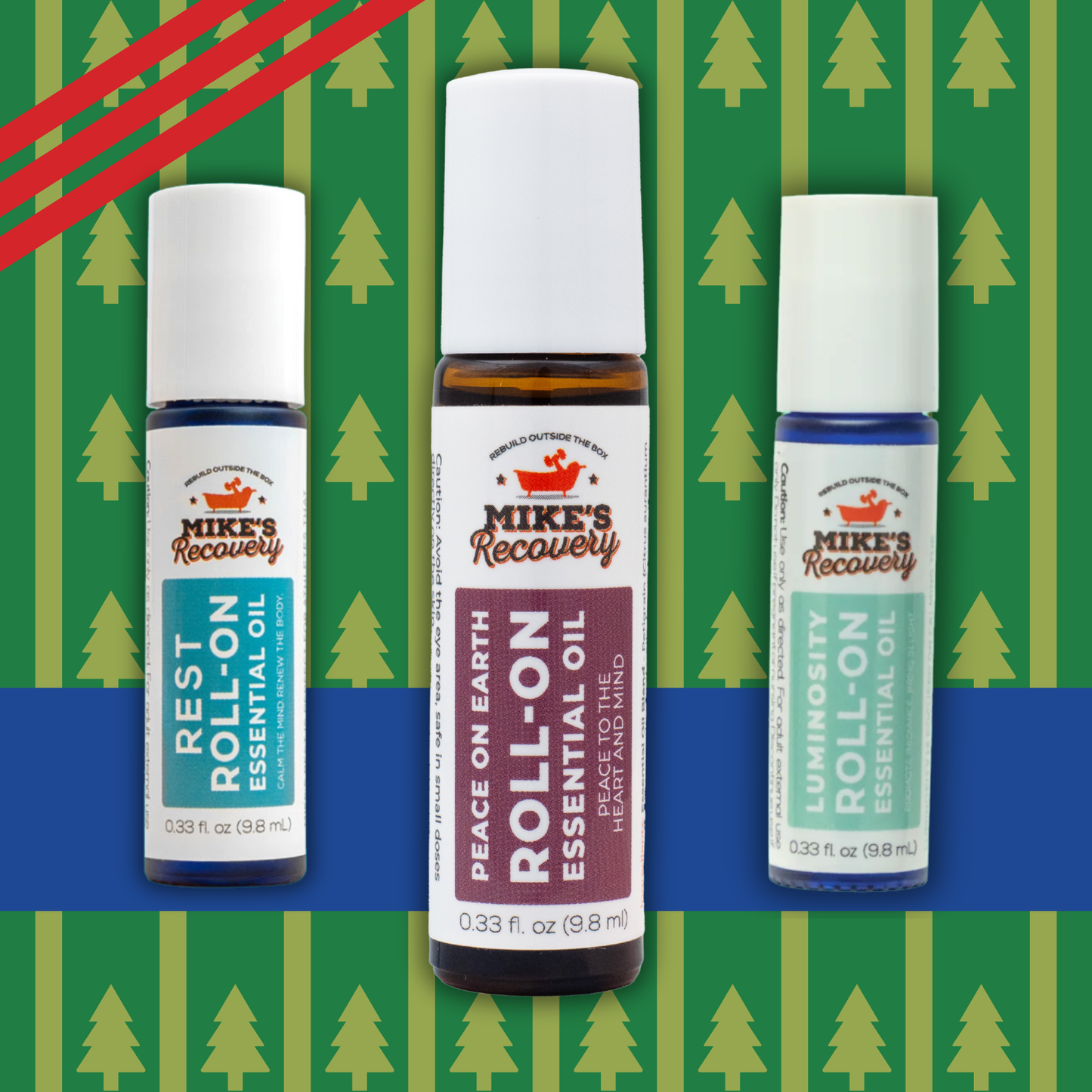 Three roll-on essential oil bottles with labels on a green and blue patterned background